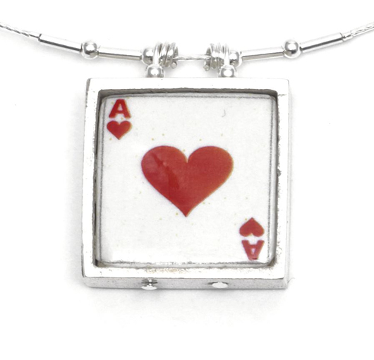 Handmade ceramic and sterling silver 'Ace of Hearts' pendants by Welsh crafts company Noa Jewellery, priced at 30 pounds ($48) at the Courtauld Gallery Shop. Image courtesy Courtauld Gallery.